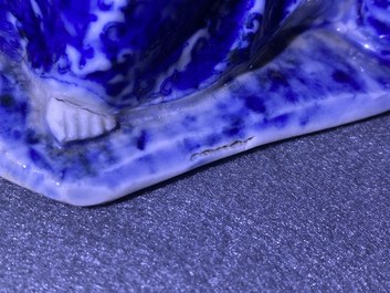 A Chinese blue and white figure of a seated Guanyin, 19th C.